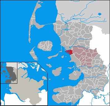 Ryc. 1. Położenie miasteczka Ockholm (kolor ciemno czerwony) w gminie Bredstedt (kolor blado czerwony) w powiecie  Nordfriesland (kolor szary) w granicach Niemiec.